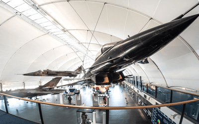 Interior view of a museum with aircraft displays
