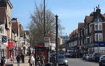 Busy street view with shops and pedestrians