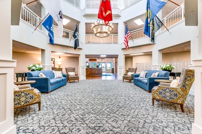 Bright common area with seating and flags