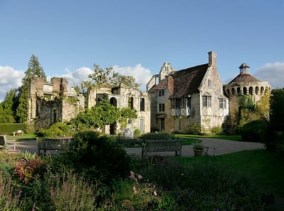 Exterior view of an assisted living facility with gardens