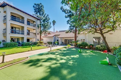 Outdoor putting green area next to the building