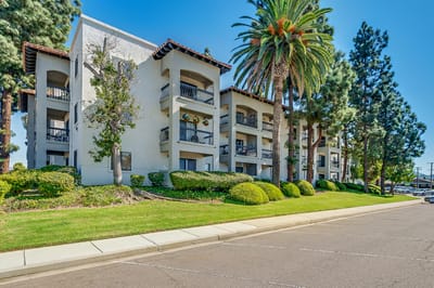 Exterior view of Solstice Senior Living building with palm trees
