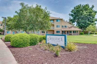 Exterior view of Solstice Senior Living with landscaped grounds
