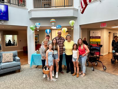 Residents and family celebrating in a common area