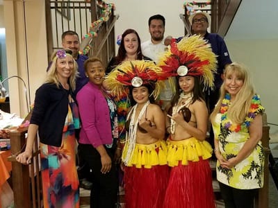 Staff and residents celebrating with Hawaiian-themed attire