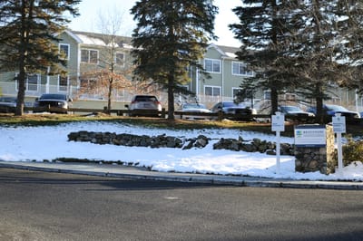 Exterior view of Benchmark Senior Living facility in winter