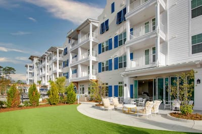Exterior view of Portside at Grande Dunes with landscaped area