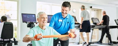 Vi at Lakeside Village, Nursing Home in Lantana, FL — Seniors engaging in fitness activities with staff assistance
