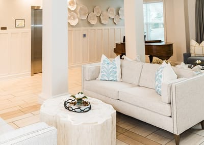 Bright and welcoming lounge area with seating and decor