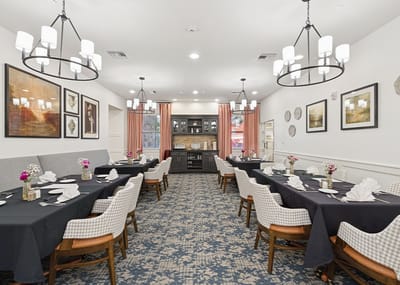 Dining area with neatly set tables and decor