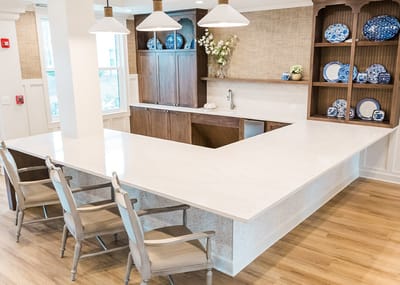 Bright, modern kitchen area with seating and decor