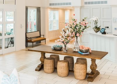 Bright common area with floral decorations and seating