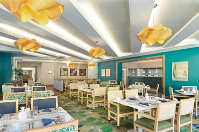 Bright dining room with tables set for meals