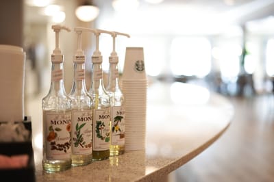 Beverage dispensers and cups on a countertop