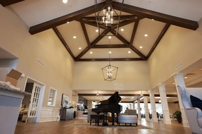 Interior view of a spacious lounge with piano