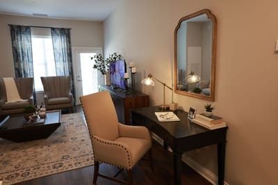 Cozy interior with a desk and armchair in a senior living space