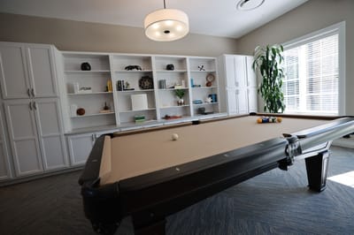 Interior view of a game room with a pool table