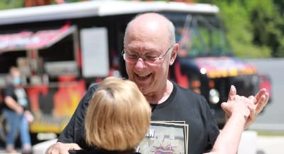 Residents dancing and enjoying an outdoor event