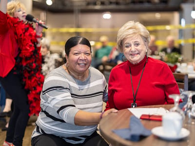 Two residents enjoying an activity in a common area