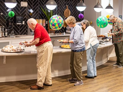 Residents enjoying a meal in a dining area