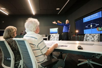 A resident presentation in a modern meeting room