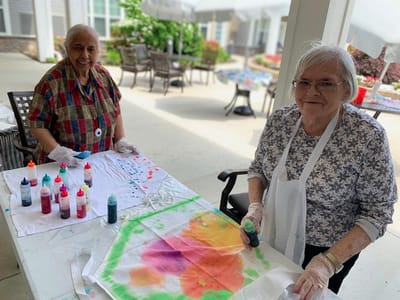 Residents engaged in a colorful activity outdoors