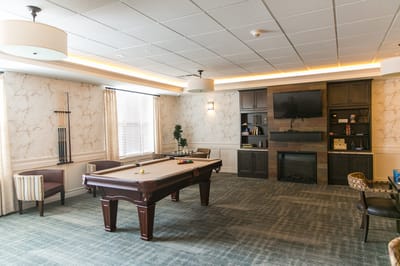 An interior view of a common area with a pool table