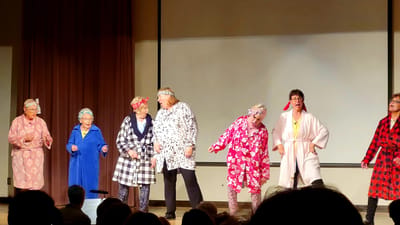 Residents performing in a playful theater show