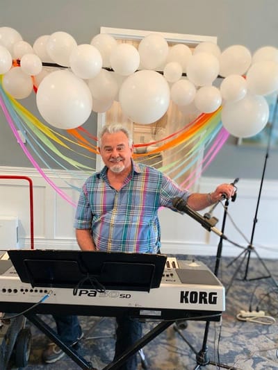 Musician performing in a decorated activity space