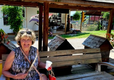 Senior woman enjoying a drink in an outdoor space