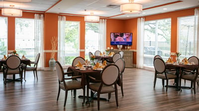 Elegant dining area with round tables and natural light