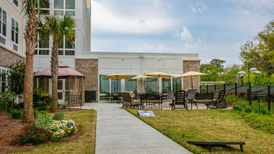 Outdoor patio area with seating and umbrellas