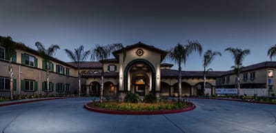 Exterior view of Ocean Hills Senior Living facility at night