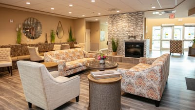 Cozy lounge area with seating and a fireplace