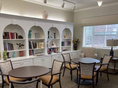 Cozy common area with bookshelves and seating