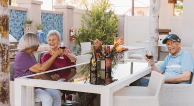 Residents enjoying drinks in an outdoor gathering space