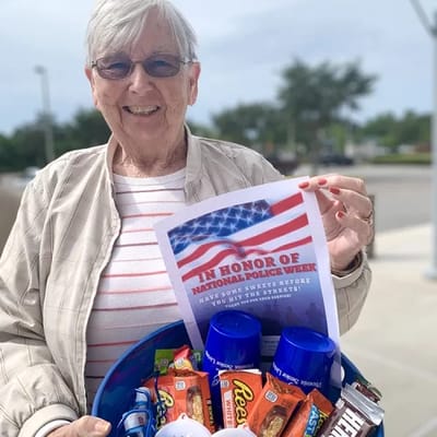 Senior resident celebrating National Police Week with treats