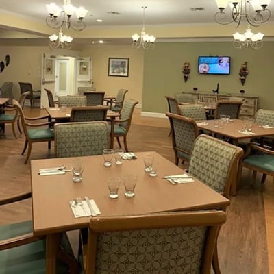 Dining room with tables set for residents
