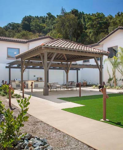 Outdoor space with seating and gazebo.
