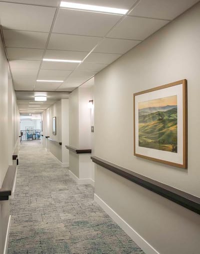 Bright hallway with artwork and lighting