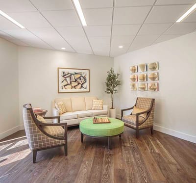 Bright common area with seating and artwork