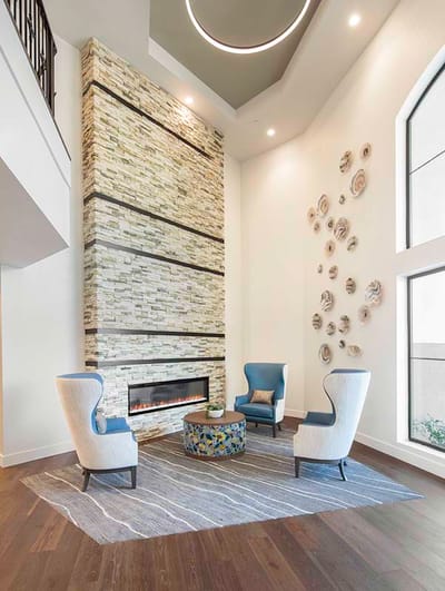Modern lobby area with comfortable seating and fireplace
