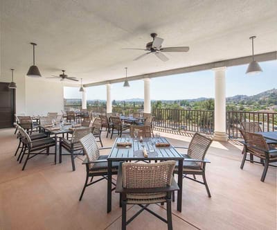 Outdoor dining area with tables and chairs