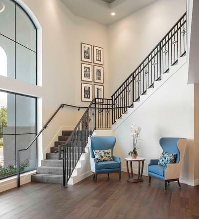 Bright interior lobby with seating area and staircase