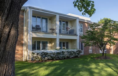 Building exterior with landscaped area and balconies