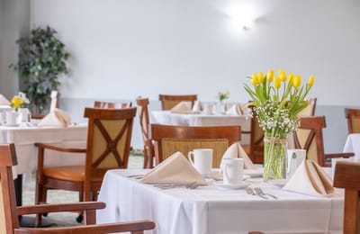 Dining area with tables set for a meal