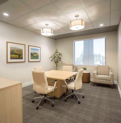 Bright conference room with seating and artwork