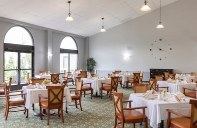 Dining area with tables set for a meal