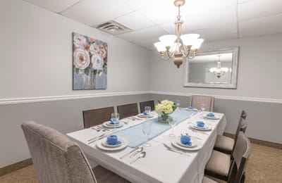 Well-set dining table in a bright dining room