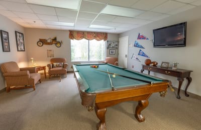 Game room with a billiards table and seating area